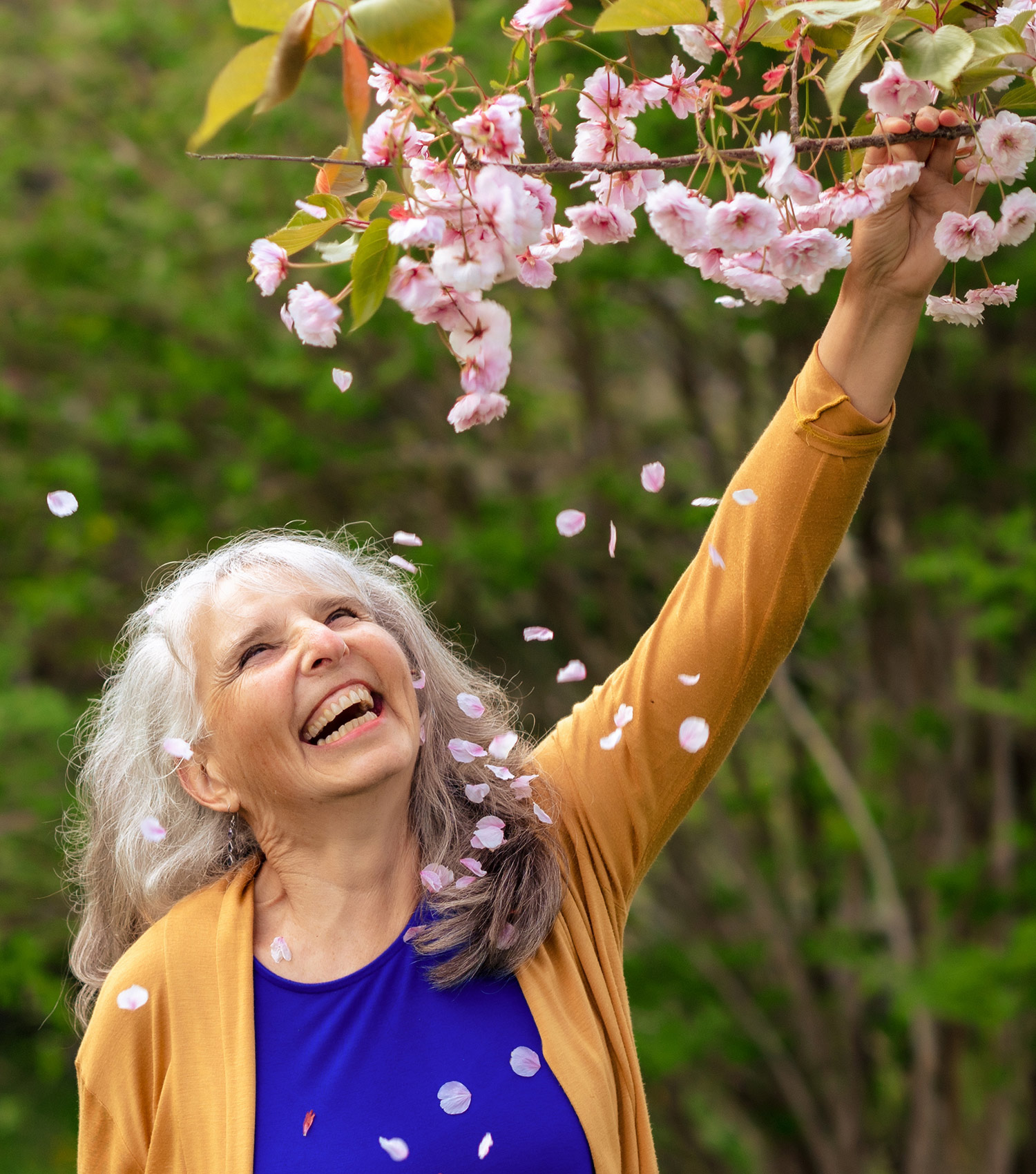 roberta smelling flowers